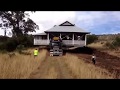 Huge house being relocated by truck through outback paddock in Warwick, QLD