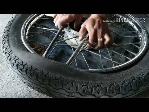 वीडियो: आप सड़क बाइक टायर कैसे निकालते हैं?