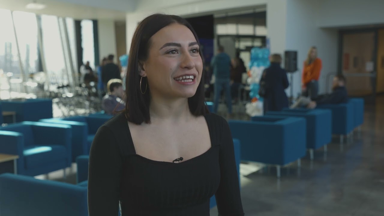 Cameras film a man running onto a field