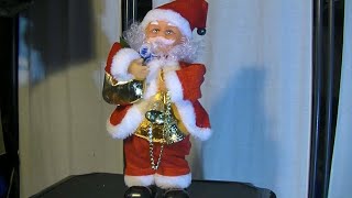 Foot tapping Santa Claus with a bag and bells (Traditional model)