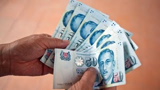 Singapore Dollar Further Weakness Expected, NAB's Tan Says