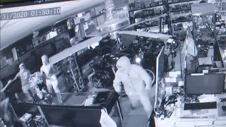 Surveillance video shows thieves ransacking pawn shop