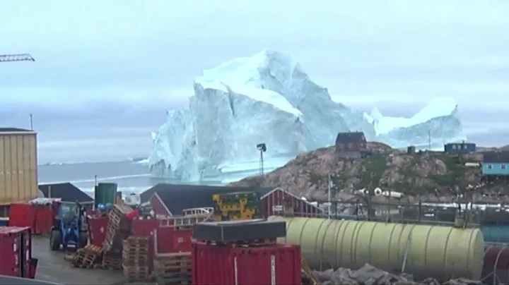 Video Shows Massive Iceberg Drifting Towards Small Village