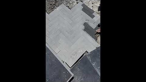 basalt as a dimensional stone. light grey to dark grey coloured tiles.