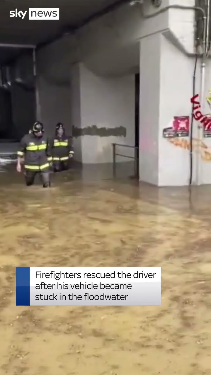 Driver rescued from floods in Italy