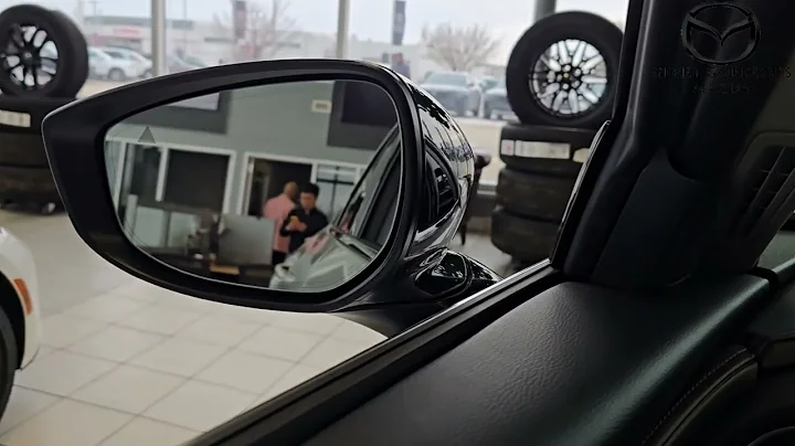 Mazda side mirror: auto tilt feature