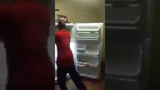 drunk guy destroys fridge