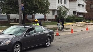Flagger helps students cross construction zone on E. 222nd Street in Euclid
