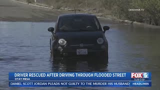 Driver Rescued From Flooded Street