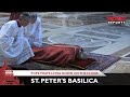 Pope prays lying down on the floor of St. Peter's Basilica