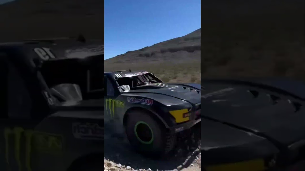 Flying close to the ground, a land-based aircraft,the Baja 1000 Trophy Truck Rally! 