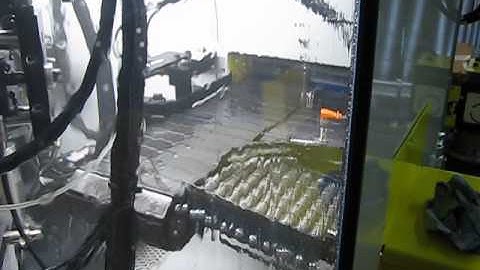 1062-8 Automatic Deburr & Wash System at the output conveyor