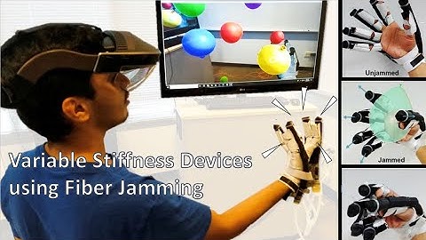 Variable Stiffness Devices using Fiber Jamming for Application in Soft Robotics and Wearable Haptics