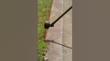 Edging the Lawn with a Weed Eater - Up Close Lawn Edging Action