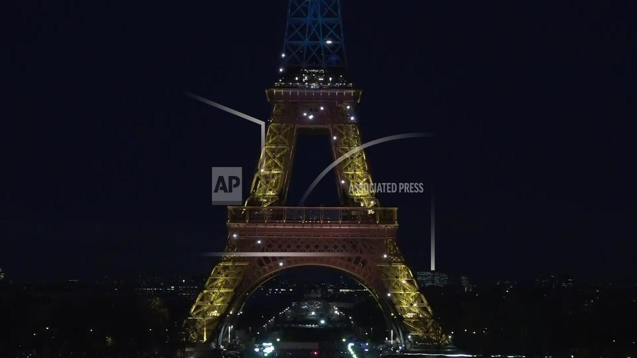 Eiffel Tower lit up in the colors of the Ukrainian flag to mark anniversary of Russia's invasion
