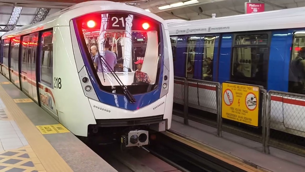 LRT Kelana Jaya Line Alstom Innovia Metro 300 (set 18&17) arriving and departing at KL Sentral.