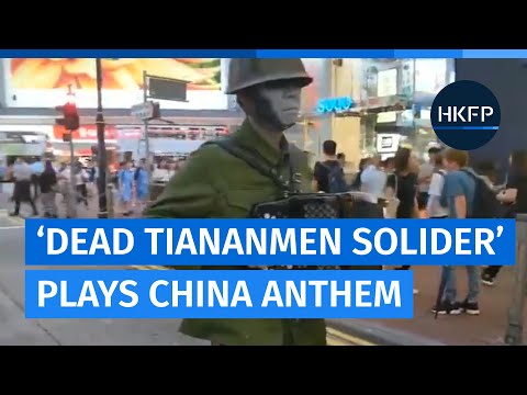 Artist plays ‘funeral version’ of Chinese anthem dressed as dead Tiananmen soldier