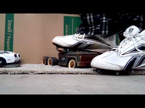 Football cleats crush old truck