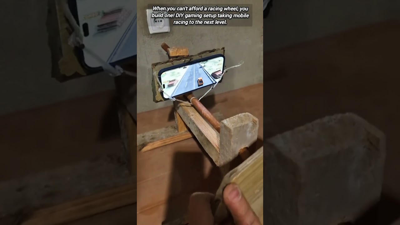 Ingenious DIY wooden steering wheel for mobile racing game.