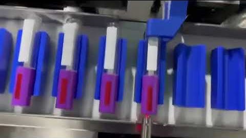 Lip gloss bottles bottom and side labeling machine.