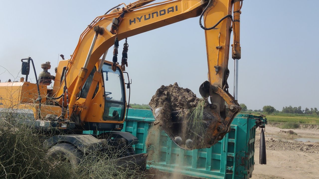 Excavator Heavy Machinery in Action: Sand Loading Scene - YouTube