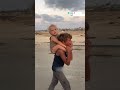 Displaced Gaza Child Carries Sister South Amid Israeli Offensive