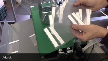 Tape application on transparent foil with a Paperfox FTD-1 tape applicator.