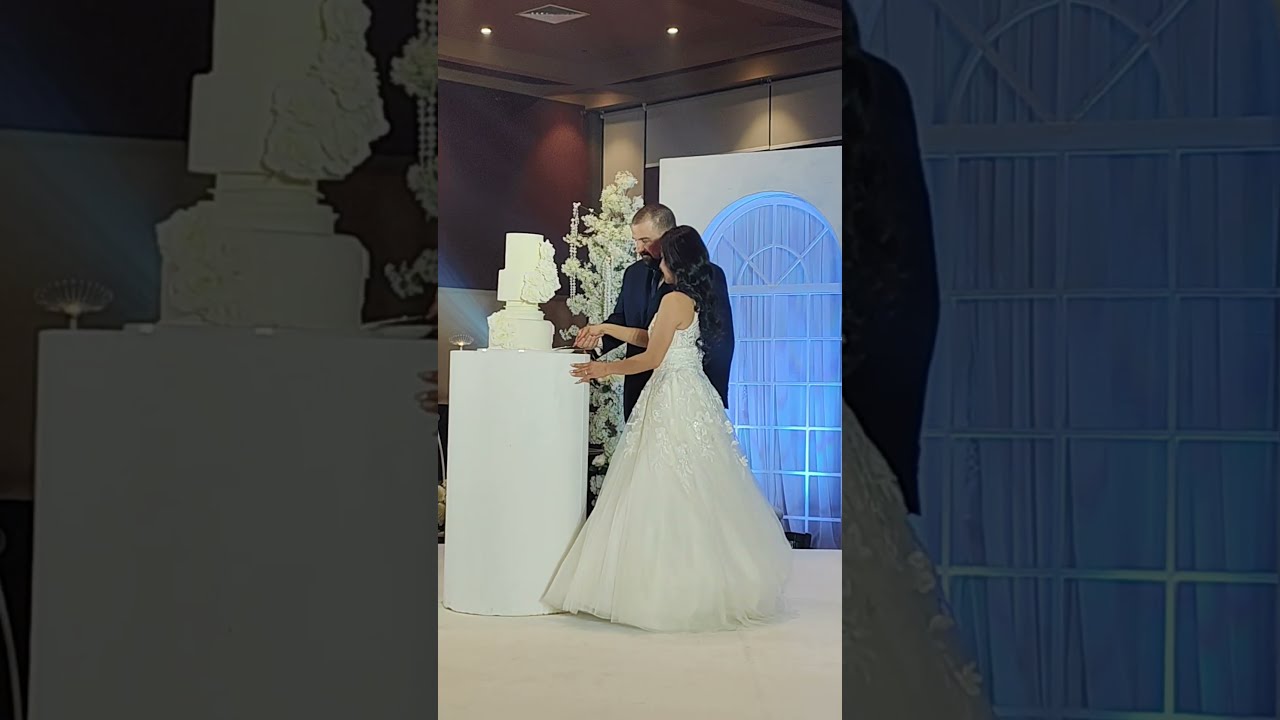 Amarie And Jack Slicing Their Wedding Cake