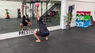 Kettlebell Deep Squat, Bottoms Up Single Arm Shoulder Press demonstration