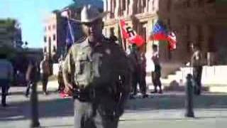 Riot police exiting the capitol building in austin,tx,usa at a nazi
rally.