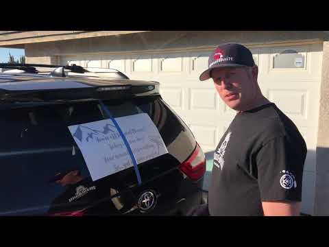 How to install a large vinyl sticker on the rear window of a vehicle