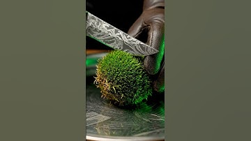 Cutting a floating moss orb with surreal precision #ai #asmr #abstract