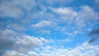 Amazing Beauty Stunning White Clouds Flying Across the Blue Sky on a Bright Summer Day in Real Time