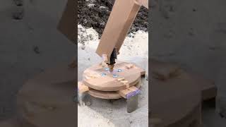 Mr.Manhole on a Tractor Cuts Circles To Remove Manhole Frames