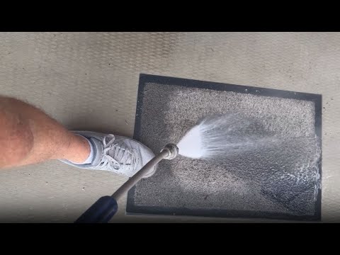 Satisfying process of cleaning a floor mat with pressure washing