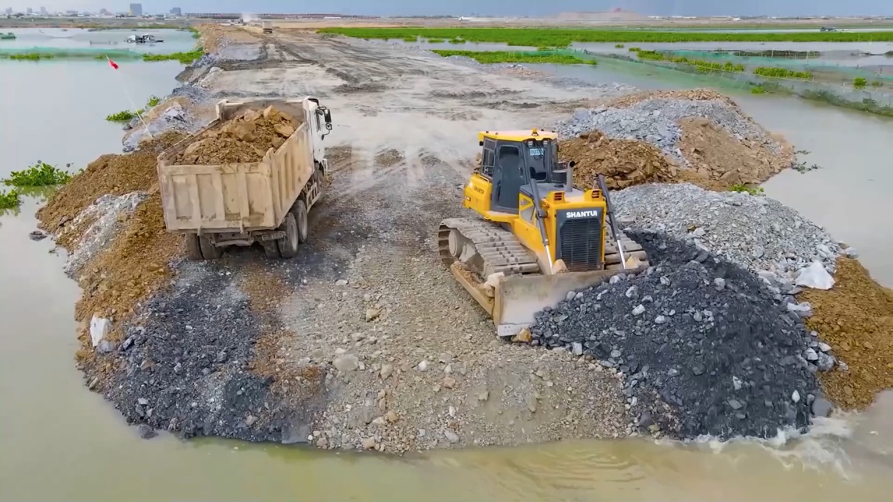 Be Watchful Process Bulldozer Operator Push Rock to Link the Land Boundary and Construction Road