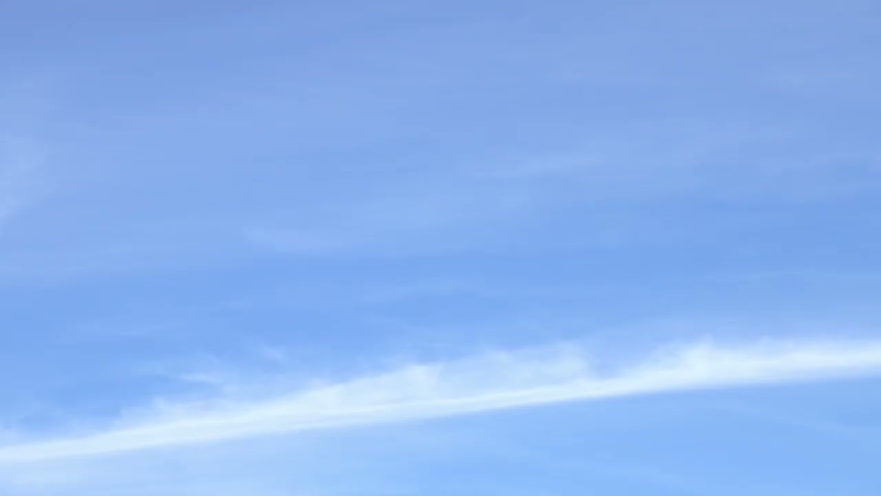 Light Blue & White Clouds Transition Across The Sky