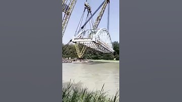 Erection of Steel Truss Bridges Using Barges