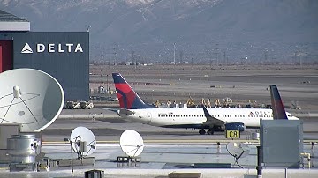 Delta passengers describe experience after emergency slide suddenly deploys, injuring one