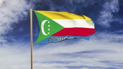 4K Comoros flag with title waving in the wind. Looping sun rises style. Animation loop Stock video