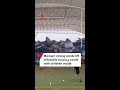 Moment strong winds lift inflatable bouncy castle with children inside
