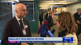 NYC transit head greets riders at reopened M train station