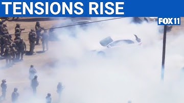 Standoff between federal agents, protesters at ICE raid as a California marijuana farm | FOX 11 LA