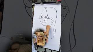 Drawing a Cartoon Portrait Live in the Street