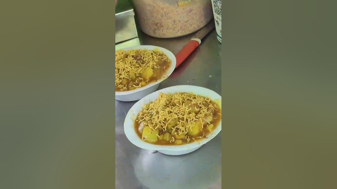 Man Selling Dahibara Aloodum On His Electric Auto Food Truck In man-selling-dahibara-aloodum-on-his-electric-auto-food-truck-in