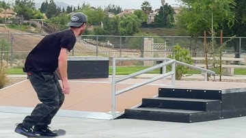 Boardslide up the park rail