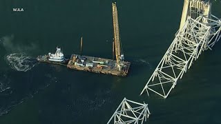 Cranes arriving to start removing wreckage from deadly Baltimore bridge collapse