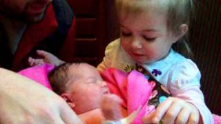 Meet Your New Baby Sister!   Adorable big sister meets newborn sister for the first time.  So cute!