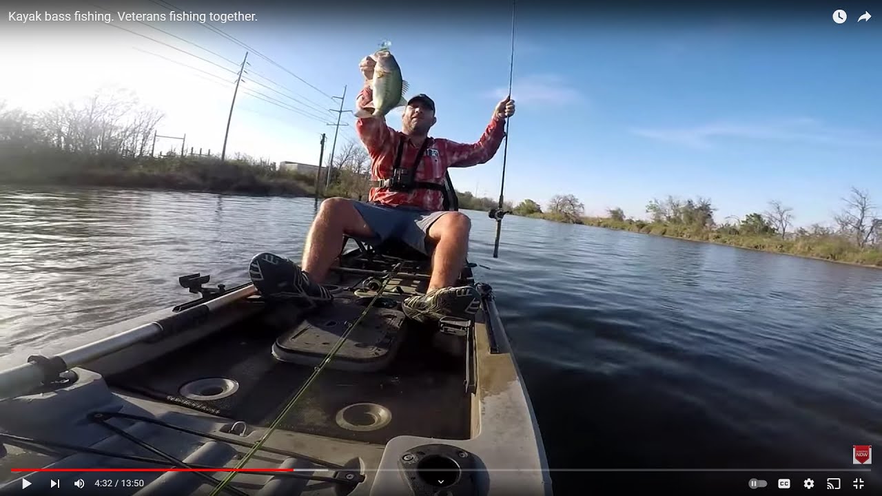 Kayak bass fishing. Veterans fishing together.