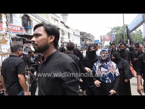 Muharram procession with mourners and religious flags at Kashmere Gate, Delhi